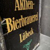 Aktien Bierbrauerei Lübeck - Glaswerbeschild im Rahmen (Um 1925)