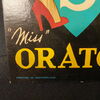 Orator Uhren - Pinup - Werbeaufsteller Miss Orator -   33 x 10 cm - CH - um 1950