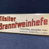 Ostdeutsche Hefewerke Tilsit - Tilsiter Branntweinhefte (Blechschild um 1930) BCM