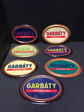 Siebener Set ovale Garbaty Semi-Licht Kunststoffschilder (Um 1920)