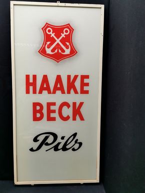 Haake Beck Glaswerbeschild im Rahmen (50er Jahre) - Variante 1 mit S im Schreibschriftstil und Wappenschatten