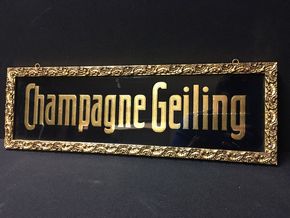 Geiling Champagne Glasschild im Schmuckrahmen. (Um 1925)