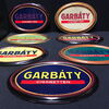 Siebener Set ovale Garbaty Semi-Licht Kunststoffschilder (Um 1920)