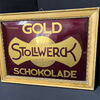 Stollwerck - Gold Schokolade / Gewölbtes Imoglasschild im Originalrahmen (Um 1915)
